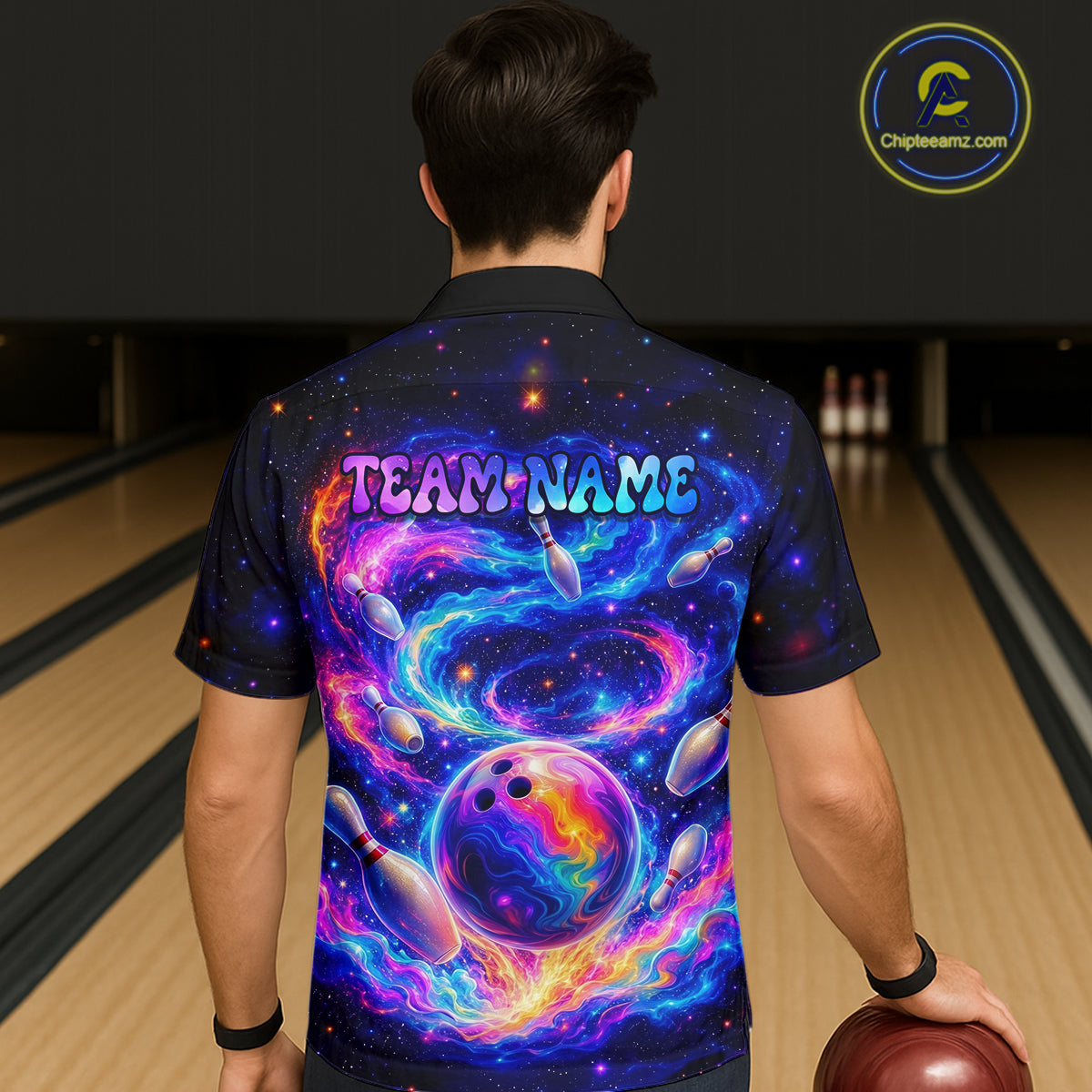 Person wearing a colorful bowling shirt with a galaxy design and 'TEAM NAME' text, standing on a bowling lane.