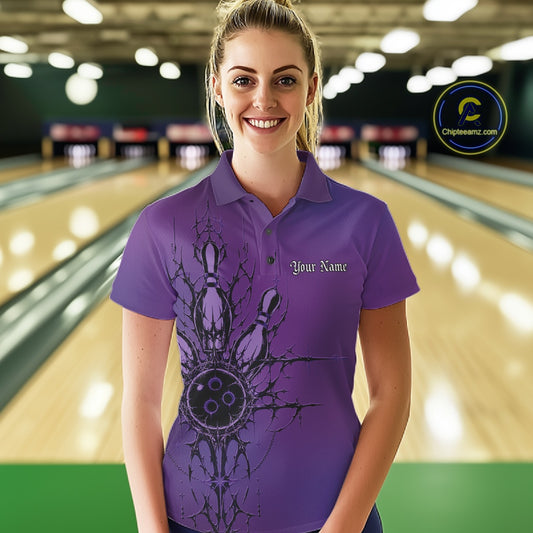 Woman wearing a purple bowling shirt with a design and text in a bowling alley.