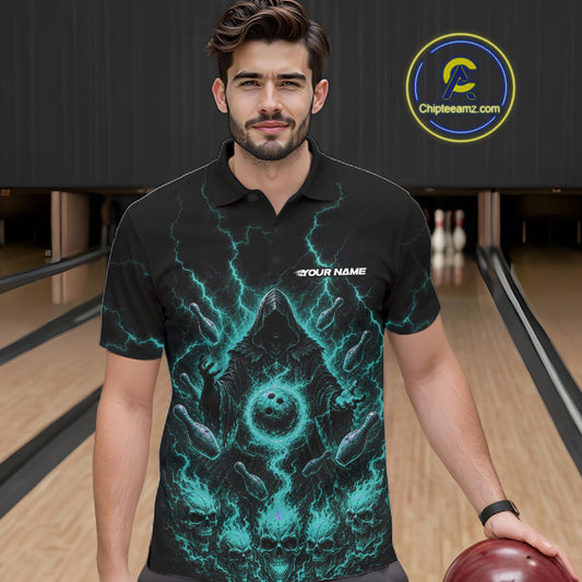 A man wearing a black short-sleeve polo shirt with a glowing teal lightning and skull graphic, standing in a bowling alley and holding a bowling ball.