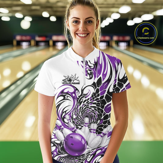 Front view of a female model wearing a white bowling quarter-zip with purple and black tribal patterns and a glossy red bowling action design