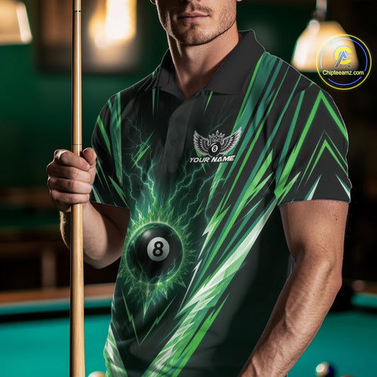 A man in a pool hall wearing a black and green custom-designed polo shirt with a 8-ball graphic and holding a pool cue.