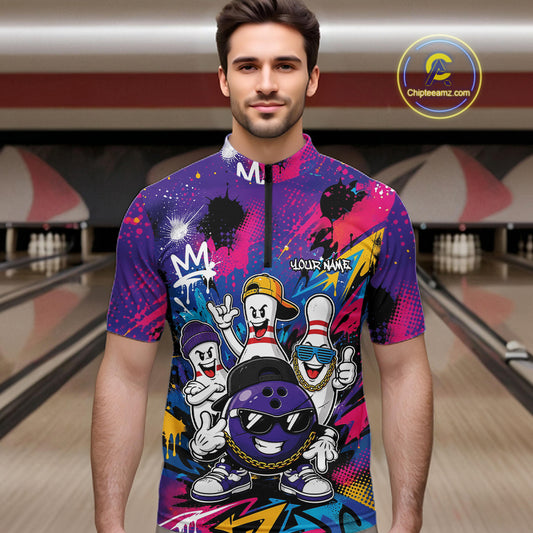 A man wearing a short-sleeve bowling jersey with a colorful bowling-themed graphic print, standing in front of a blurred bowling alley background. The jersey features cartoon bowling characters, a purple bowling ball, and graffiti-style designs in pink, purple, blue, yellow, and black.