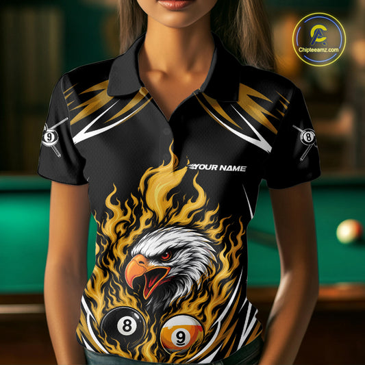 A woman wearing a black and yellow custom polo shirt featuring a flaming eagle surrounded by billiard 8 and 9 balls.