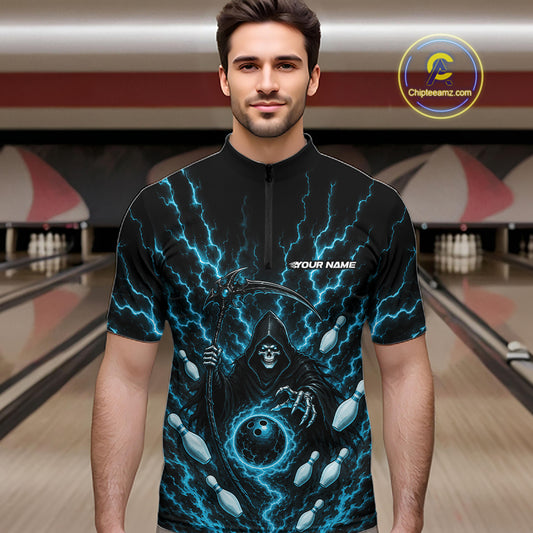 A man wearing a black short-sleeve zip-up jersey with a blue lightning and grim reaper design, standing in front of a blurred bowling alley background.