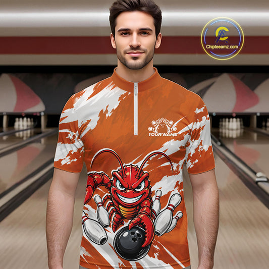 Front view of a male model in a bowling alley wearing an orange custom quarter zip bowling shirt with an aggressive crawfish bowling design and a distressed background.
