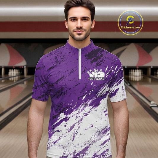 Man wearing a purple and white bowling shirt with a bowling alley in the background