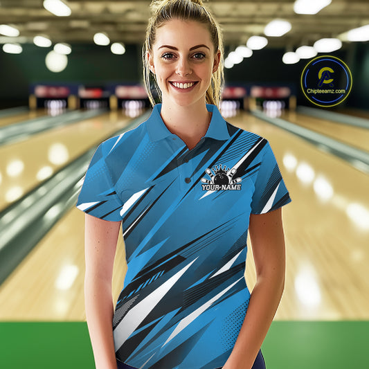 Woman wearing a blue bowling shirt with a logo and text on a bowling alley background
