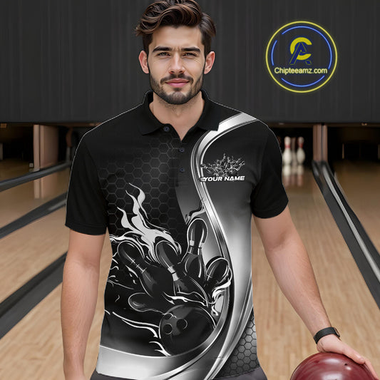 Male model seen from the front in a bowling lane wearing a black and gray polo shirt featuring a flame bowling ball and pins design in a dynamic sports scene.