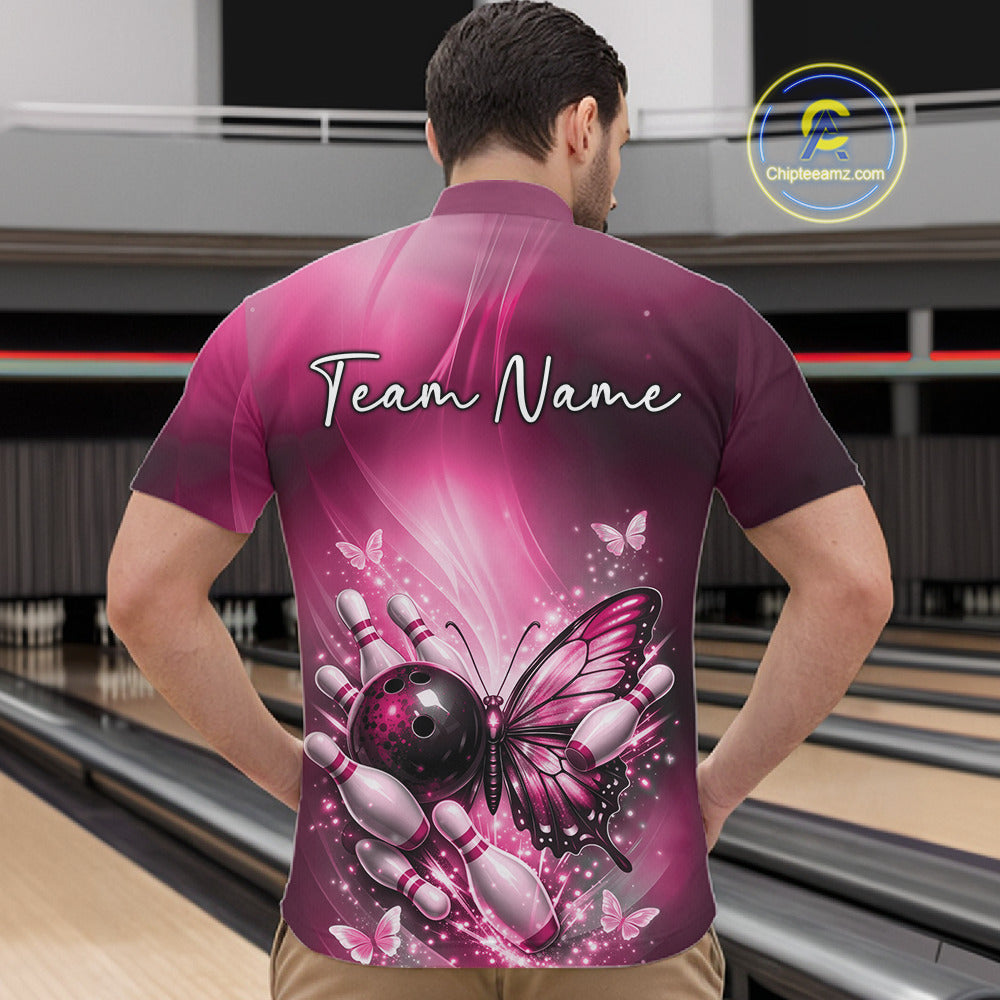 Front view of a male model in a bowling center wearing a pink quarter-zip bowling shirt featuring butterfly and bowling-themed graphics.