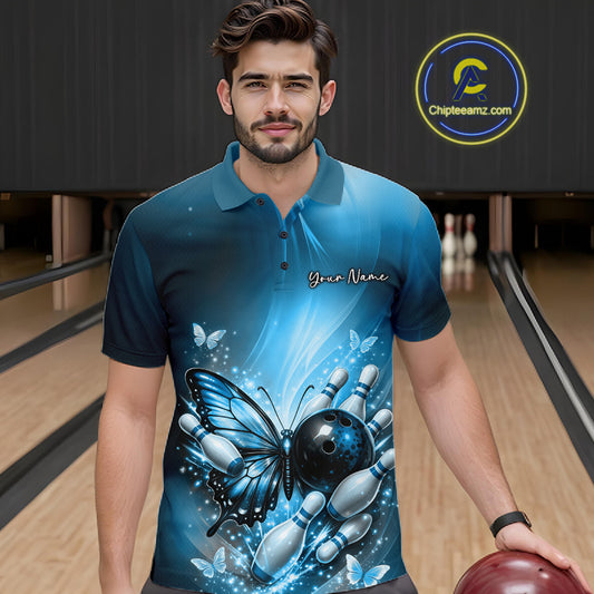 Male model wearing a blue bowling polo shirt at a bowling lane with butterfly artwork, a bowling ball, and scattered pin graphics.