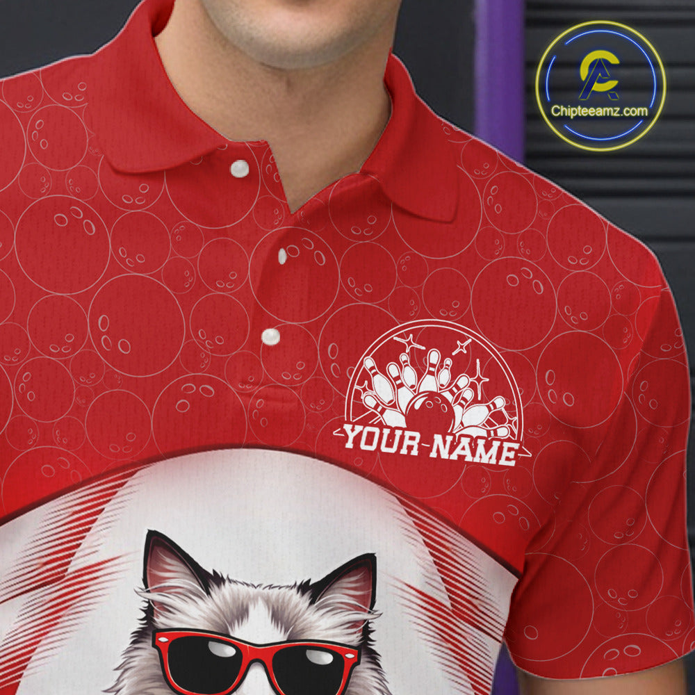 Close-up left chest detail of a white and red bowling polo shirt featuring a ragdoll cat wearing sunglasses and leaning on a bowling ball.