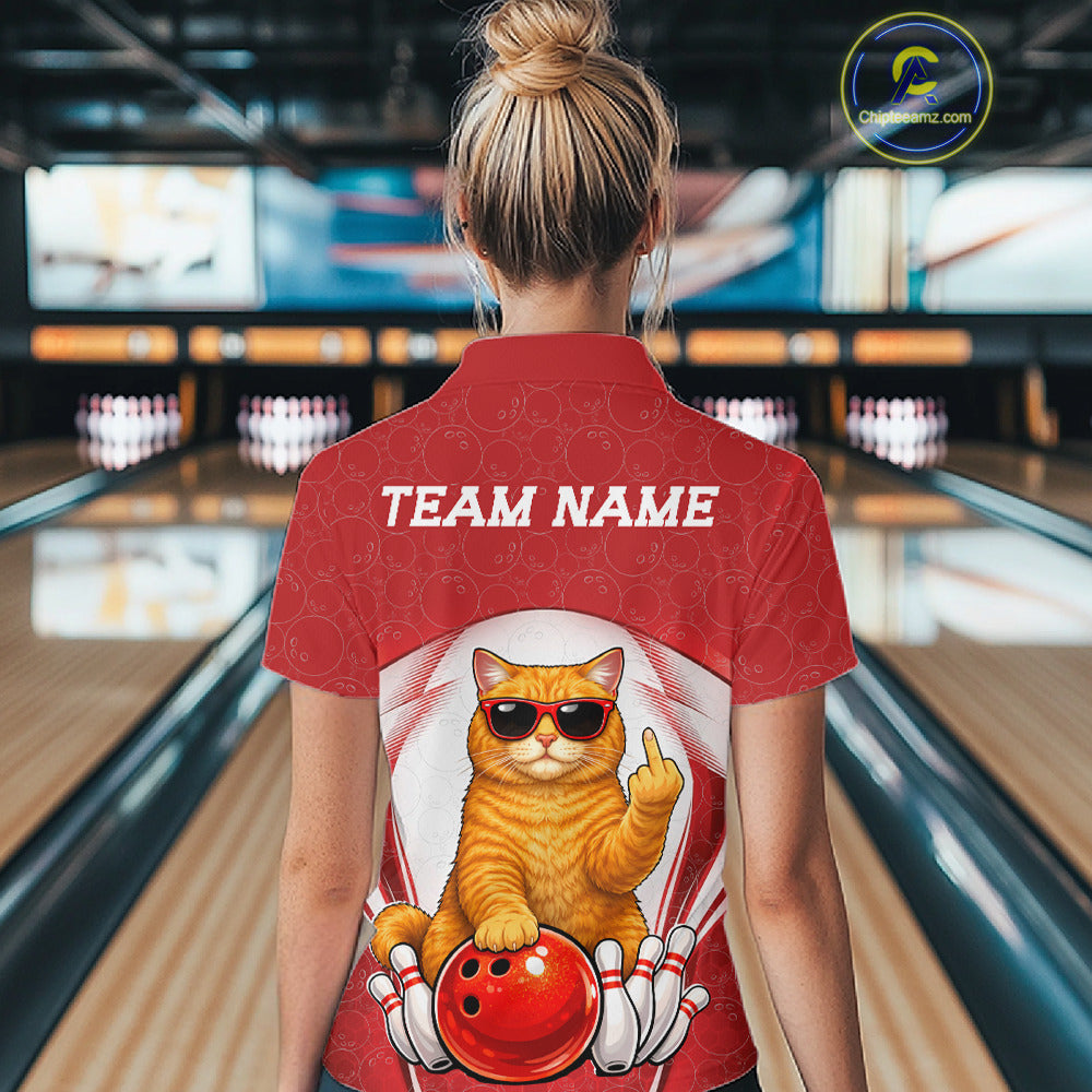 Back view of a female model in a bowling alley wearing a white and red quarter-zip shirt featuring a cool British Shorthair cat and bowling ball artwork.