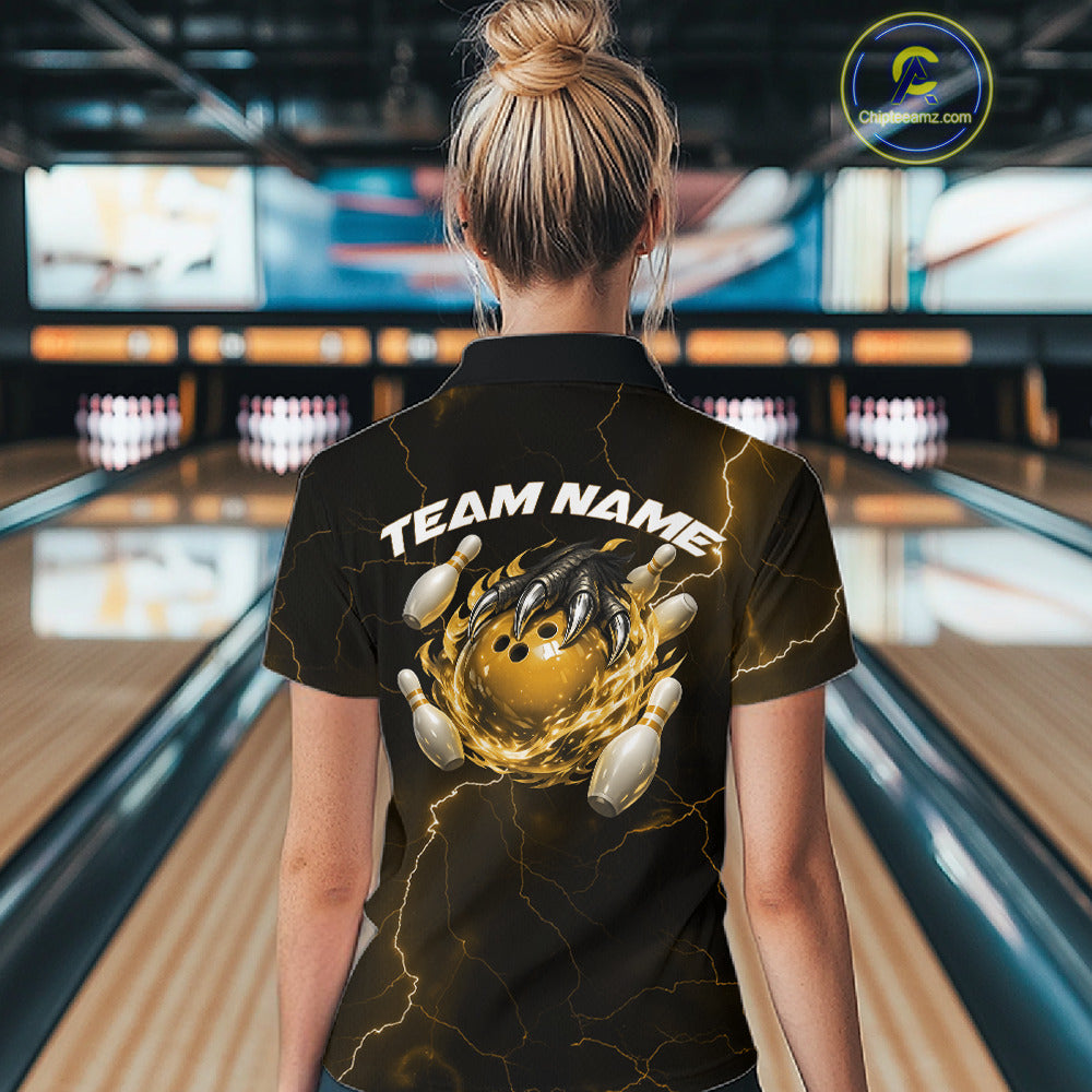 Back view of a black and yellow womens quarter-zip displaying dragon claw bowling graphics with scattered pins.