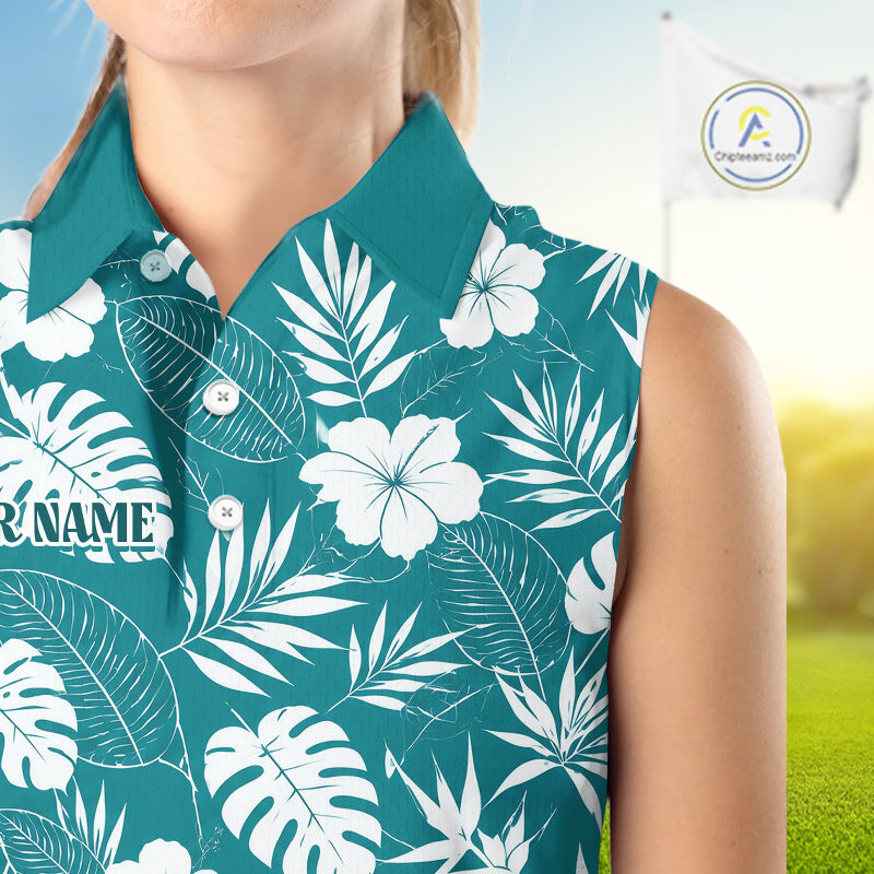 Person wearing a teal shirt with white floral and leaf pattern, blurred background