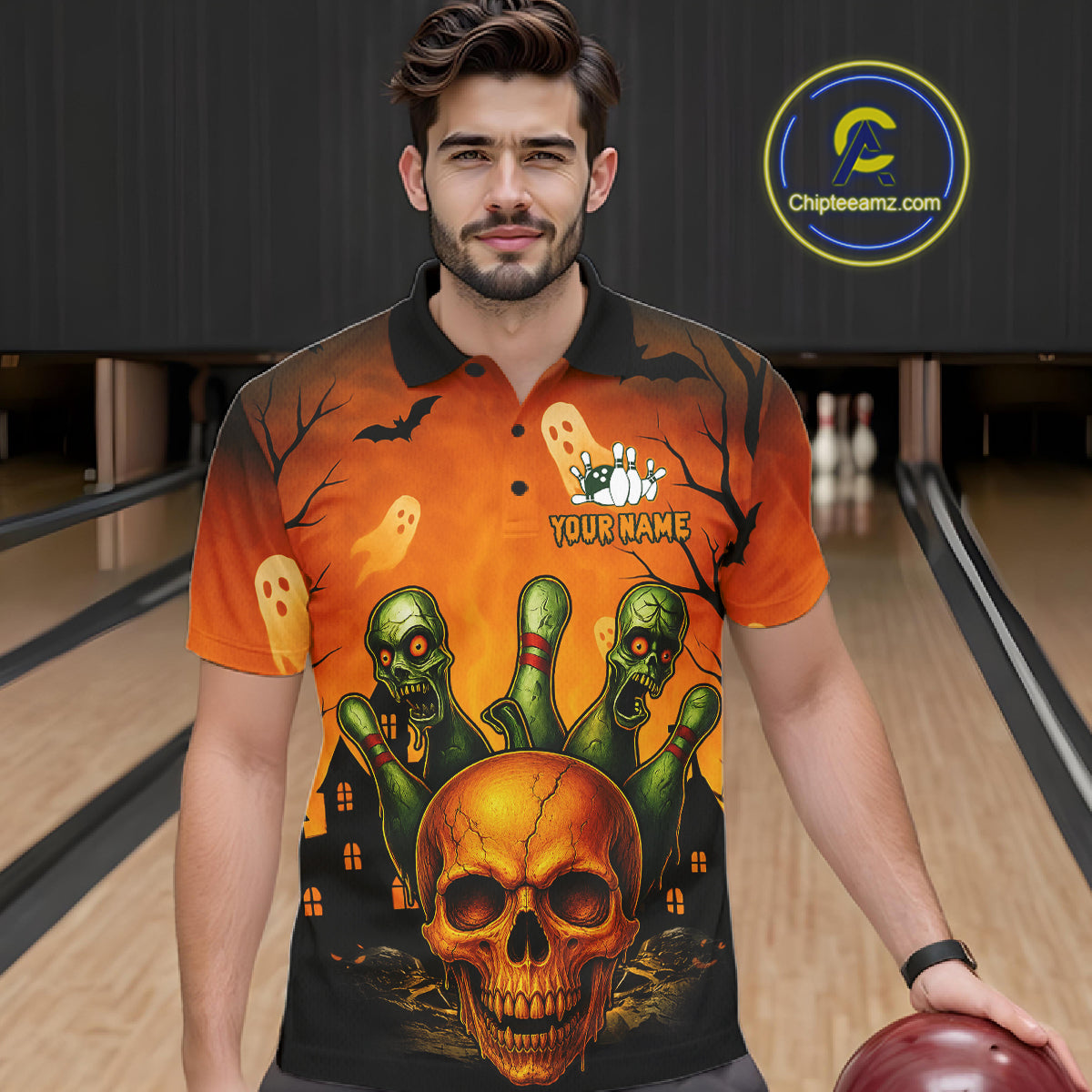 A man wearing a short-sleeve Halloween-themed bowling shirt with a skull, green zombie hands, ghosts, and bats on an orange and black background. The shirt has a mock button collar and a 'YOUR NAME' placeholder on the chest.