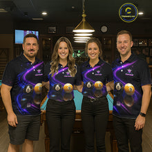 Load image into Gallery viewer, Four people standing together in a dimly lit indoor venue, wearing matching dark navy polo shirts with a purple cosmic billiards graphic featuring 8-ball and 9-ball designs. The background shows a pool table and warm hanging lights.