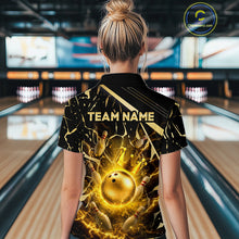 Load image into Gallery viewer, Female model wearing a custom black gold bowling quarter-zip shirt back view displaying the personalized team name above a glowing bowling ball with lightning energy artwork at the bowling alley