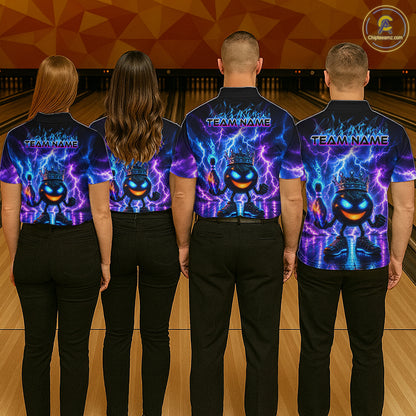 Four people wearing bowling shirts with a colorful design on a bowling alley.