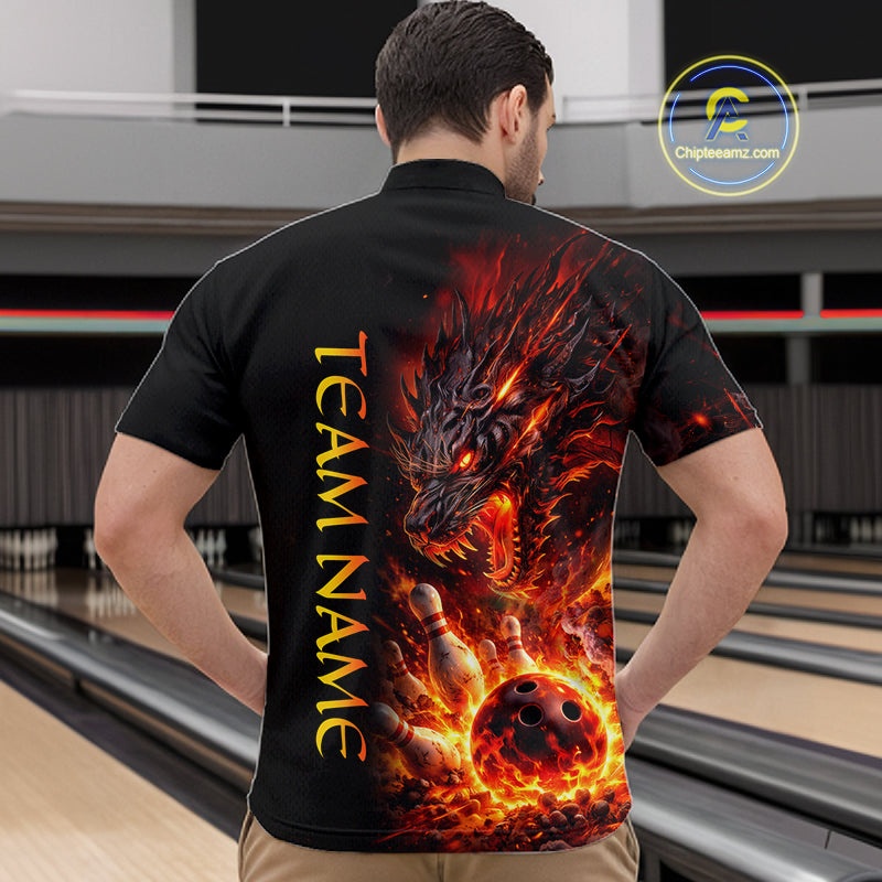 Man wearing a black shirt with a fiery dragon design and 'TEAM NAME' text at a bowling alley.