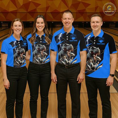 Four people standing in a bowling alley wearing matching custom-designed polo shirts with a blue and black color scheme, featuring a graphic of a roaring dinosaur and lightning, paired with black pants.