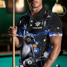 Load image into Gallery viewer, Person wearing a black polo shirt with a raccoon design holding a pool cue in a billiards setting.
