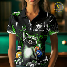 Load image into Gallery viewer, Person wearing a black polo shirt with a raccoon design and pool balls, with a pool table in the background.