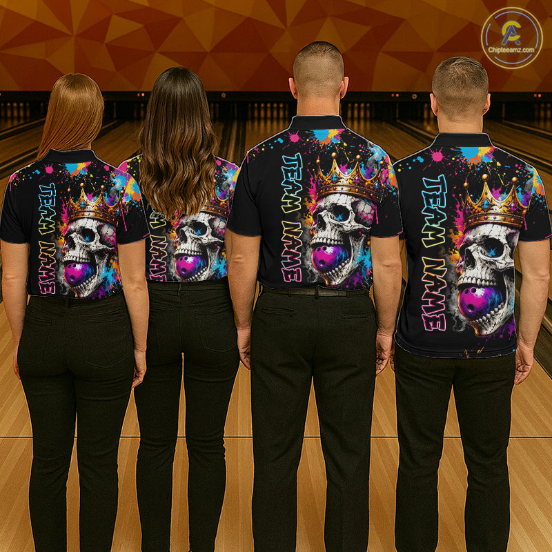 Four people wearing matching colorful bowling shirts with skull designs on a bowling alley.