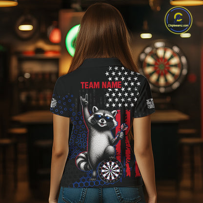 Back view of a woman wearing a custom patriotic dart polo with personalized team name and an American flag raccoon holding darts beside a dartboard in a professional dart room.