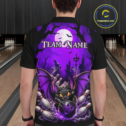 A person viewed from behind wearing a black short-sleeve polo shirt with a large purple Halloween-themed graphic on the back. The design shows bats, a full moon, a castle, a black bat-like creature with glowing yellow eyes, and bowling pins.
