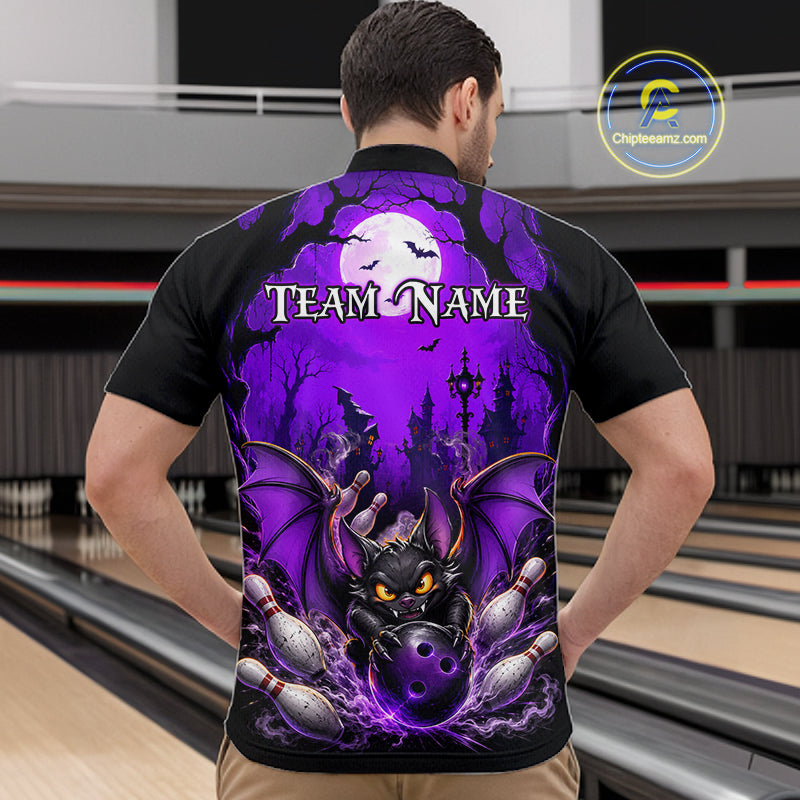 A man viewed from behind wearing a black short-sleeve polo shirt with a large Halloween-themed bowling graphic on the back. The design features a purple full moon, bats, a haunted castle, bowling pins, and a bat-shaped bowling ball, with the text 'TEAM NAME' across the upper back.