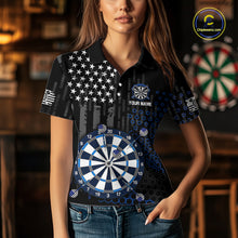 Load image into Gallery viewer, Female model wearing a custom black darts polo shirt featuring an grey American flag star pattern, a large dartboard graphic, and customizable 'YOUR NAME' text on the chest