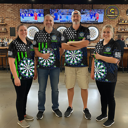 Group of four people in a sports bar wearing matching custom black darts team polo shirts featuring an green American flag and dartboard design.