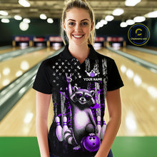 Load image into Gallery viewer, Woman wearing a black shirt with a raccoon design in a bowling alley.