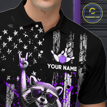 Load image into Gallery viewer, Black polo shirt with a raccoon, hand, and bowling ball design on a dark background