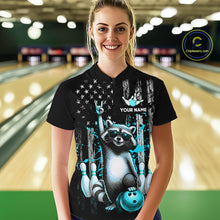 Load image into Gallery viewer, Person wearing a black shirt with a raccoon graphic and text in a bowling alley.