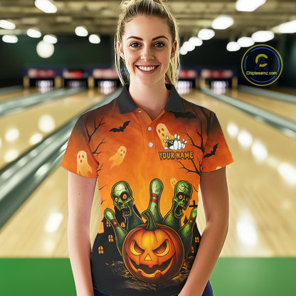 Person wearing a Halloween-themed orange shirt with graphics in a bowling alley.