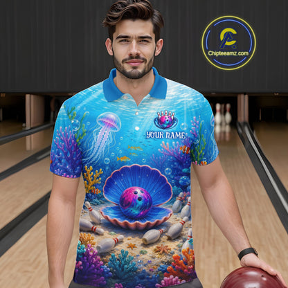 Man wearing a blue bowling shirt with ocean-themed design in a bowling alley.
