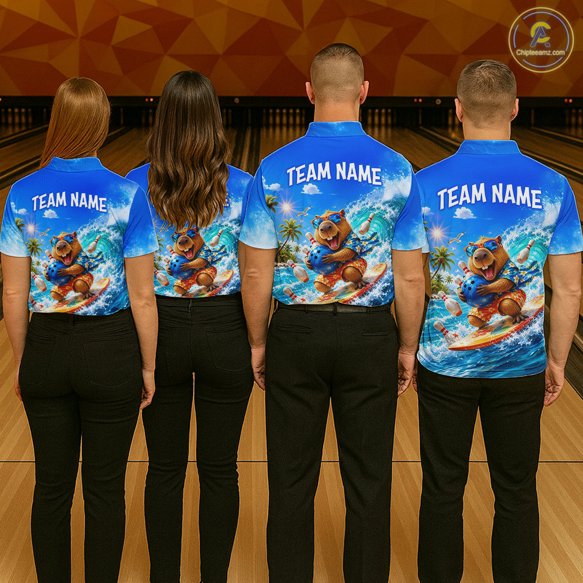 Four people wearing matching blue shirts with a bear graphic and 'Team Name' text in a bowling alley.