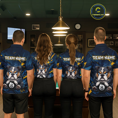 A back view of a team of four pool players standing in a line in front of a blue felt pool table in a billiards room. All four are wearing the back view of the custom black billiards polo shirt, which features a a large white 'TEAM NAME' text placeholder, and a bulldog and 8-ball motif. 
