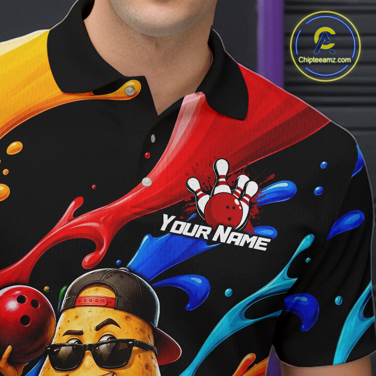 Colorful bowling-themed shirt with a character and splashes of red, blue, and yellow on a black background.