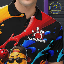 Load image into Gallery viewer, Colorful bowling-themed shirt with a character and splashes of red, blue, and yellow on a black background.