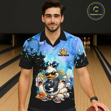 Load image into Gallery viewer, Person wearing a colorful bowling-themed shirt with cartoon characters in a bowling alley.