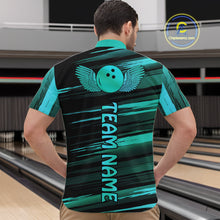 Load image into Gallery viewer, Male model wearing a custom black turquoise bowling quarter-zip shirt back view displaying the personalized team name below a turquoise bowling ball emblem at the bowling alley