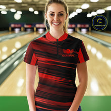 Load image into Gallery viewer, Female model wearing a custom black red bowling quarter-zip shirt front view featuring a red bowling ball emblem, dynamic red brush stroke pattern and striped design at the bowling alley