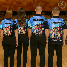 Load image into Gallery viewer, Four people wearing matching bowling shirts with cartoon characters on a bowling alley.