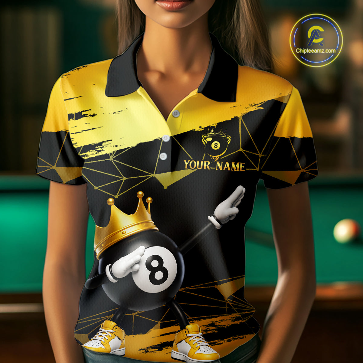 Woman wearing custom black and gold geometric crown 8 ball billiard polo shirt standing at a pool table in a billiard room