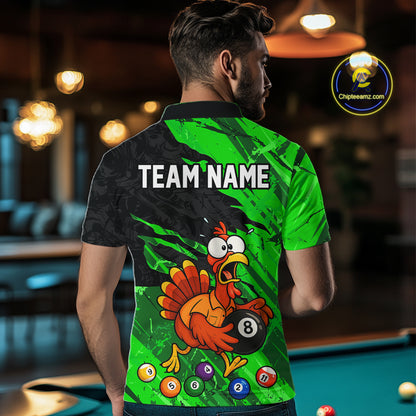 A man viewed from behind wearing a custom green and black polo shirt with a cartoon turkey holding an 8-ball and the text 'TEAM NAME' on the back. The shirt is shown in a pool hall setting with a pool table in the background.