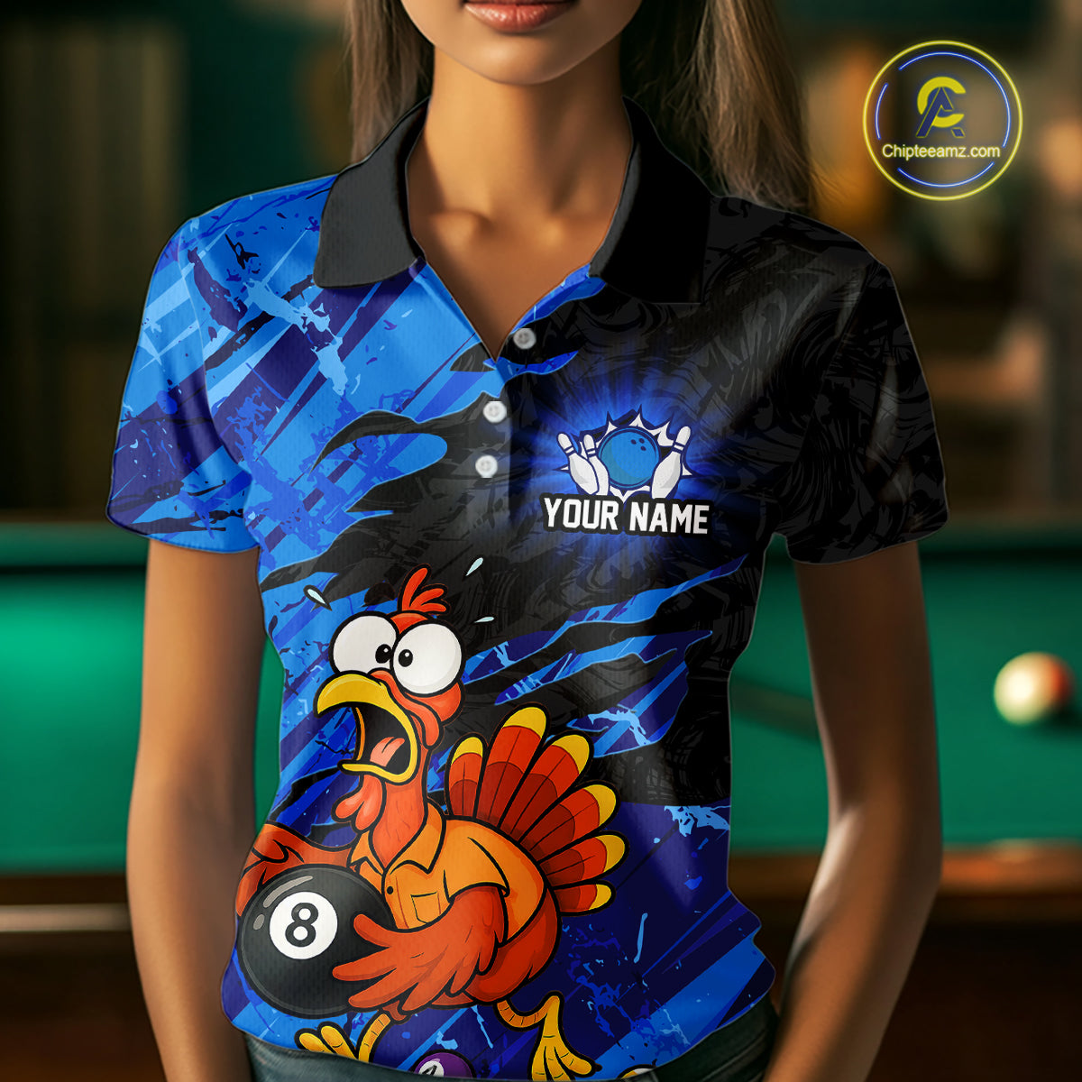 A woman wearing a custom short-sleeve polo shirt with a blue and black abstract background and a cartoon turkey holding an 8-ball. The shirt has a black collar and the text 'YOUR NAME' on the chest