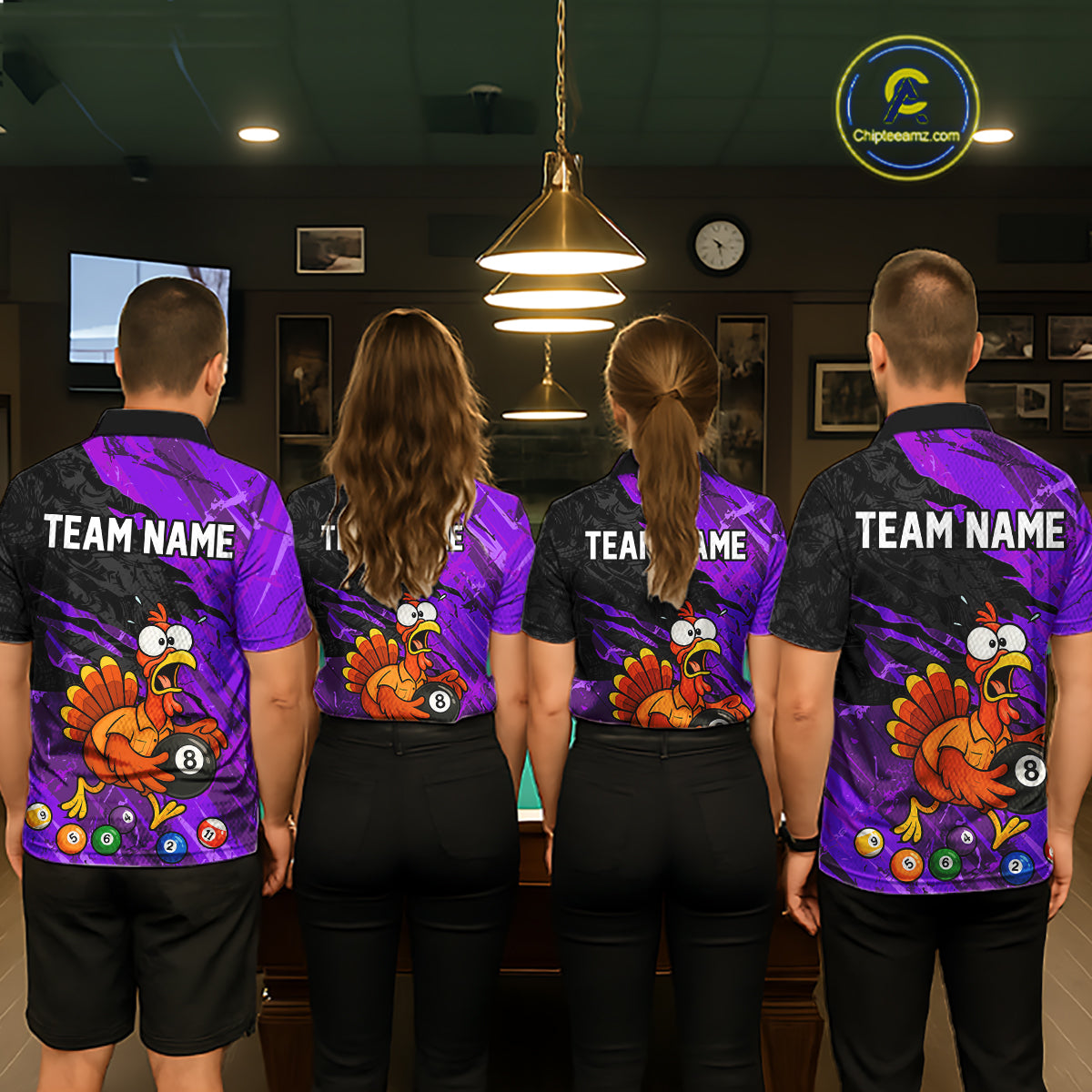 Four people standing with their backs to the camera in a dimly lit indoor room, wearing matching purple and black short-sleeve jerseys with a cartoon turkey graphic and the text 'TEAM NAME' on the back.