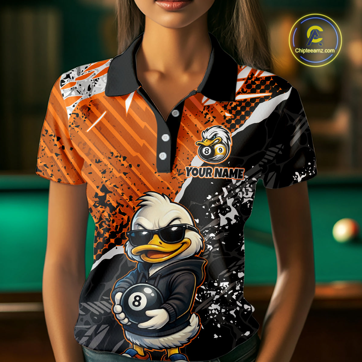 Person wearing a colorful polo shirt with a duck holding a pool ball design, set against a billiard table background.